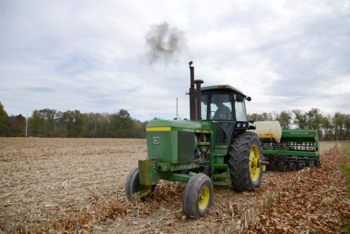 Tractor moves through field
